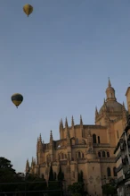 Cathedran in morning with hot air baloons