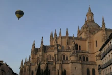 Cathedran in morning with hot air baloons