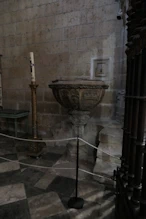 A font tucked away in the corner of a chapel