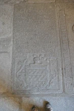 A memorial stone in the cloister dated 1717