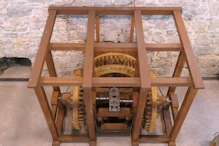 Water powered rolling coin press
