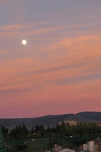 The moon with a red sky behind