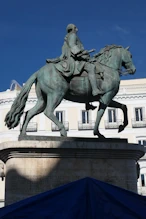An equestrian statue (the rider has a big nose)