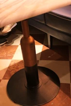 Restaurant table leg in shape of bottle