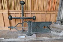A cross and weather vein from the top of the spire