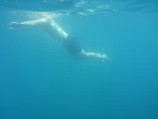 Swimming near boat