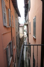 Belargio view in narrow street to lake