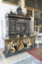 Ornate cabinet with mermen supports