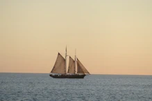 A sailing boat with golden sky