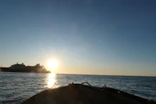 Boarding the zodiac in the sunset